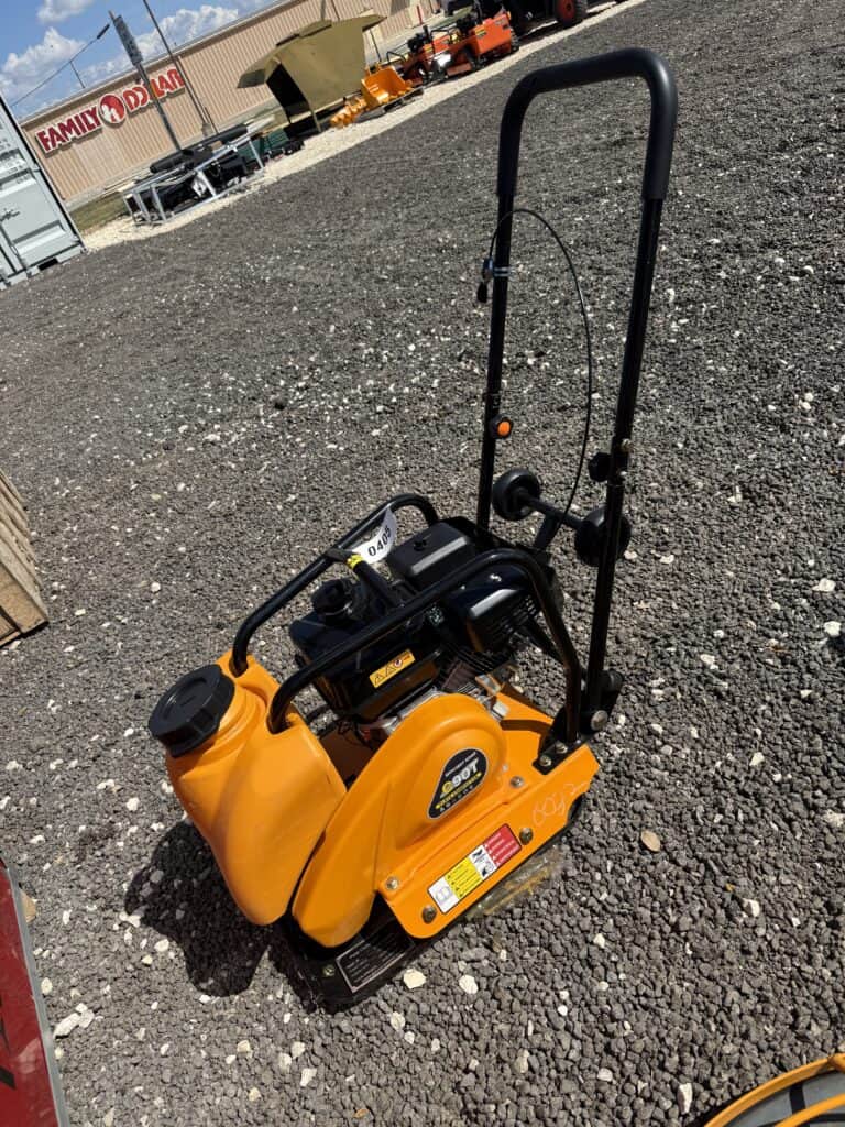 Yellow vibratory plate compactor for sale at auction.