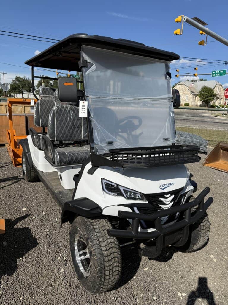 White golf cart with windshield and black bumper at auction event.