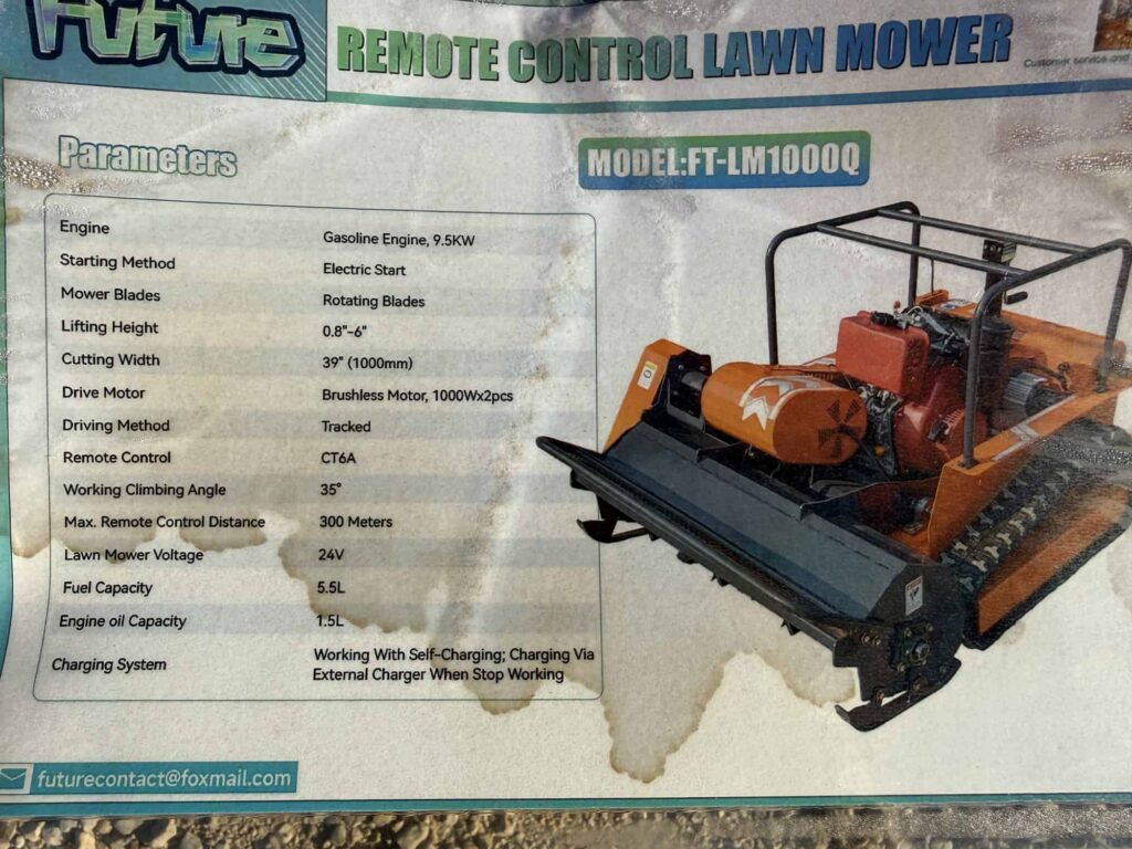 Remote control lawn mower for auction at Garrett Realty & Auction.