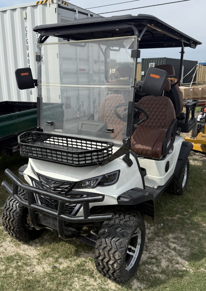 White golf cart with brown seats and black roof for auction.