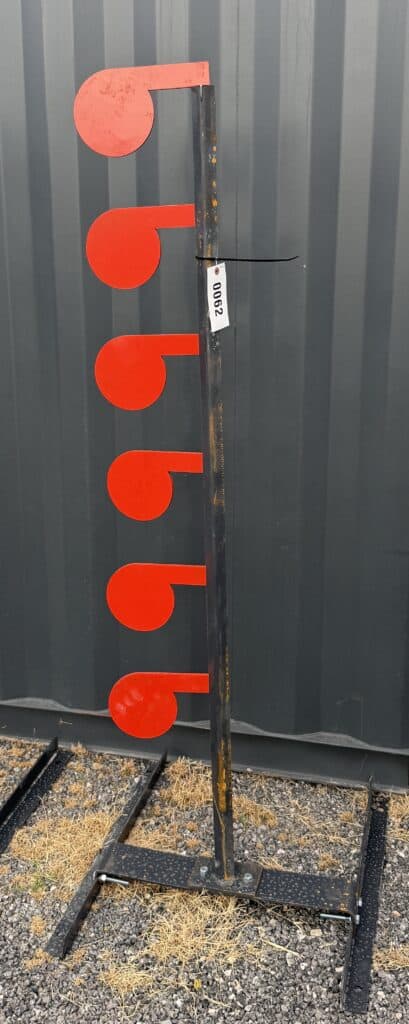 Vertical sign with red circular markers for Garrett Realty & Auction.