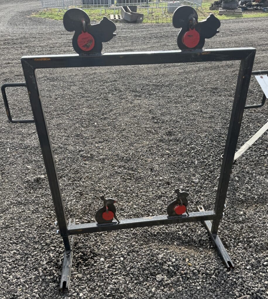 Mickey Mouse themed target shooting stand for auctions or events.