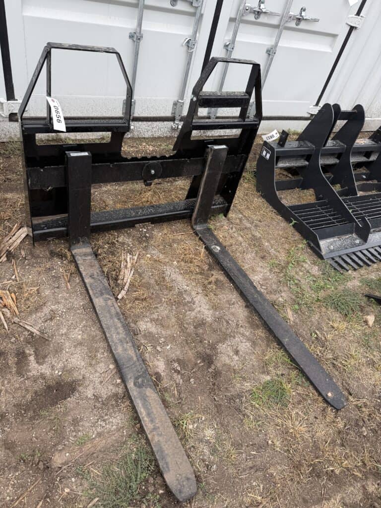 Black pallet jack with long forks for moving pallets.
