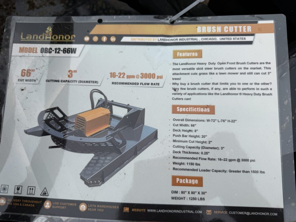 Brush cutter machine displayed for auction at Garrett Realty & Auction.