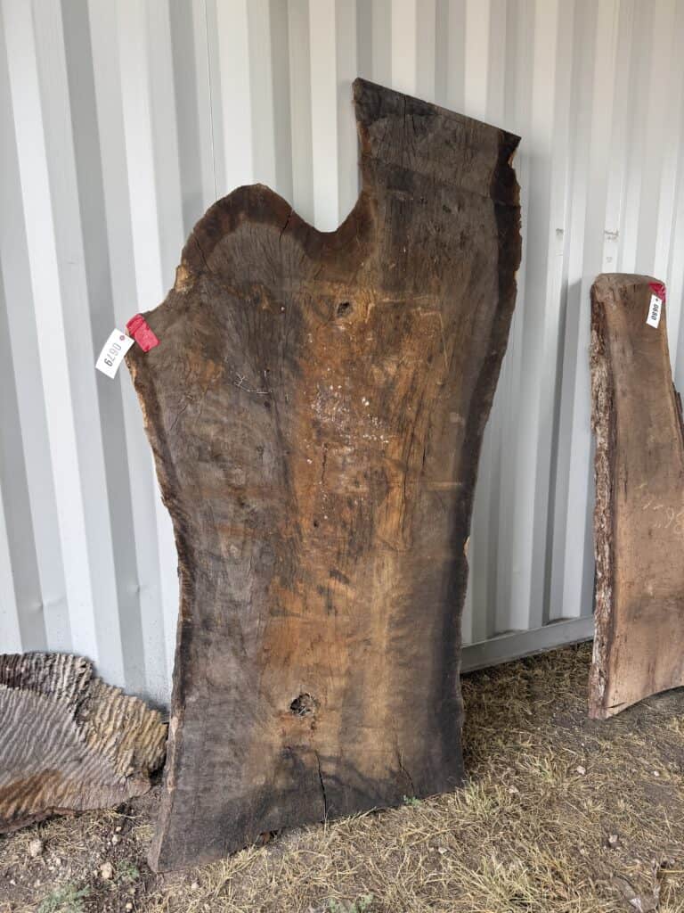 Large rustic wooden slab at Garrett Realty & Auction.