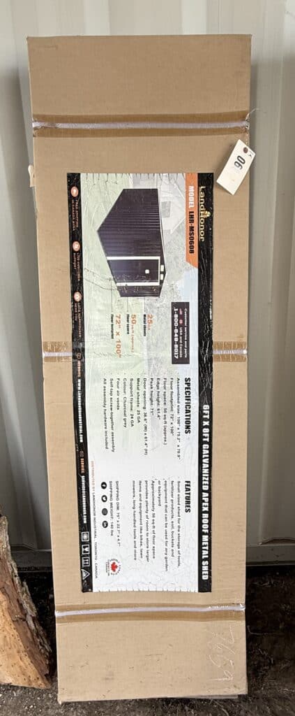 Garrett Realty & Auction branded box with equipment details for October 10th Consignment Auction.