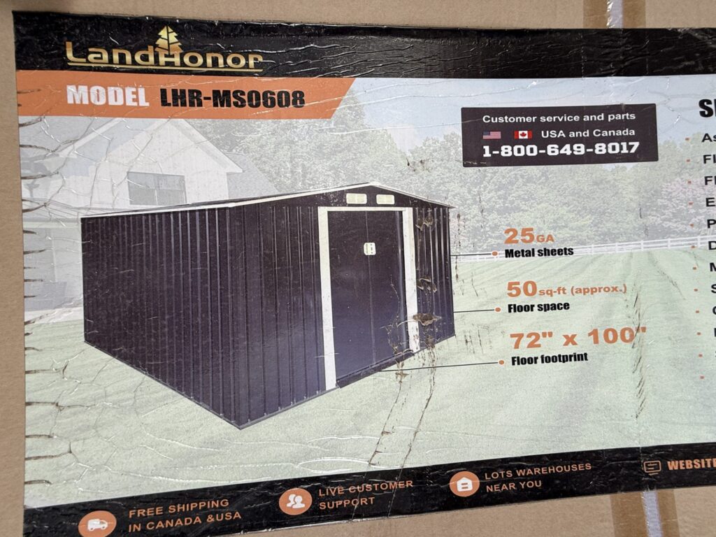 Black Horizon portable storage container on green ground at auction.