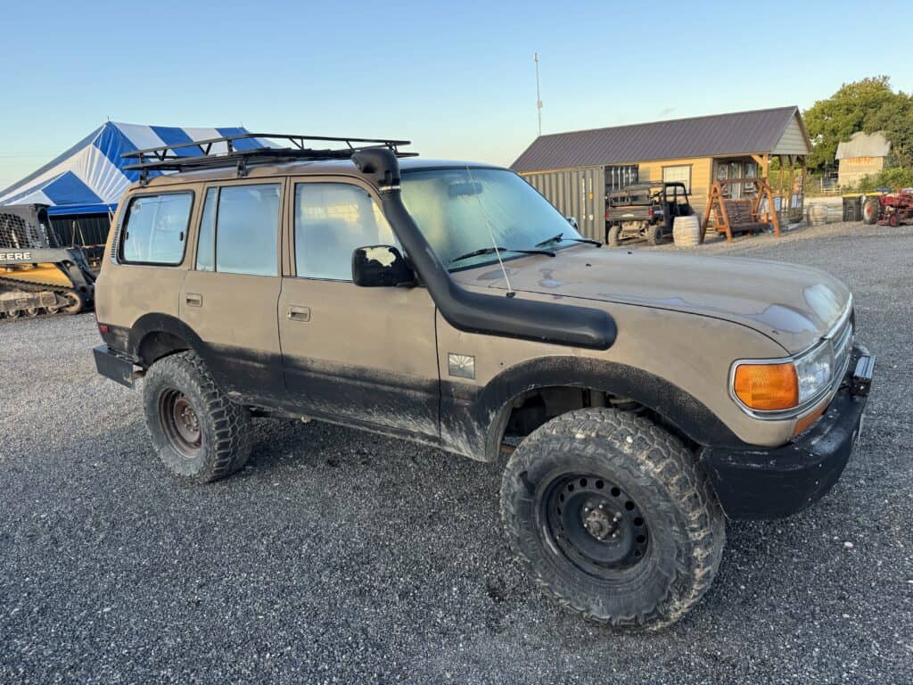 Dusty used SUV with off-road tires at October 3rd auction event.