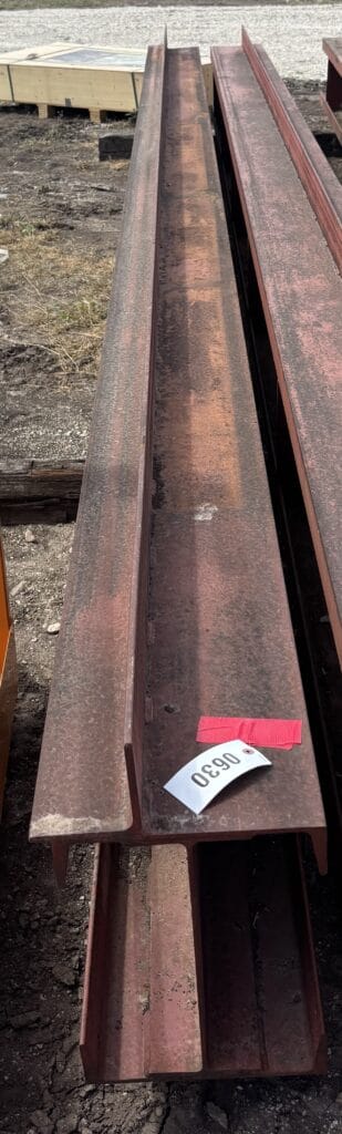 Rusty steel beams for sale at an auction site.