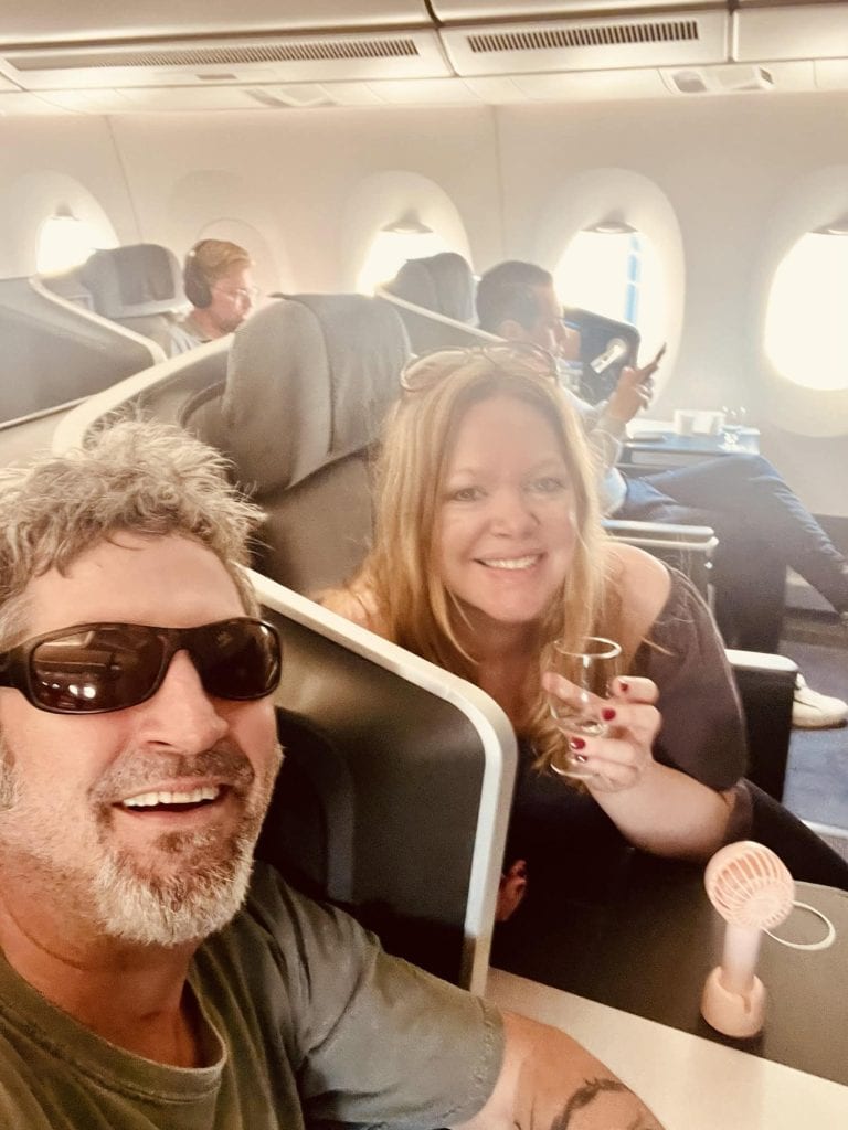 Enjoying a flight with friends on an airplane.