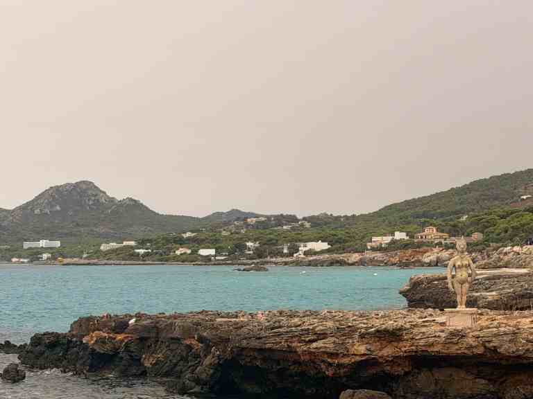 LiAnn and Theo travel at coastal cliffs overlooking the sea.