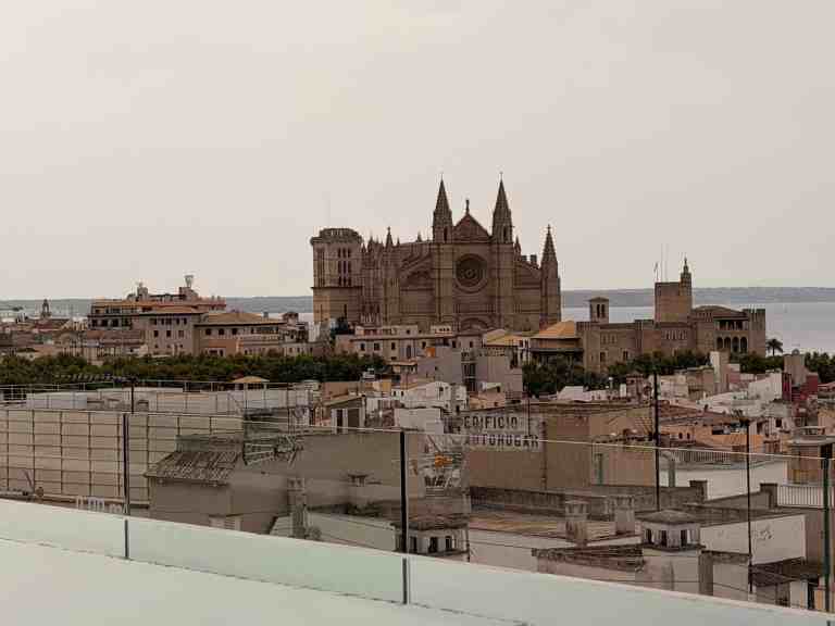Seville Cathedral and cityscape with historic architecture and river view.