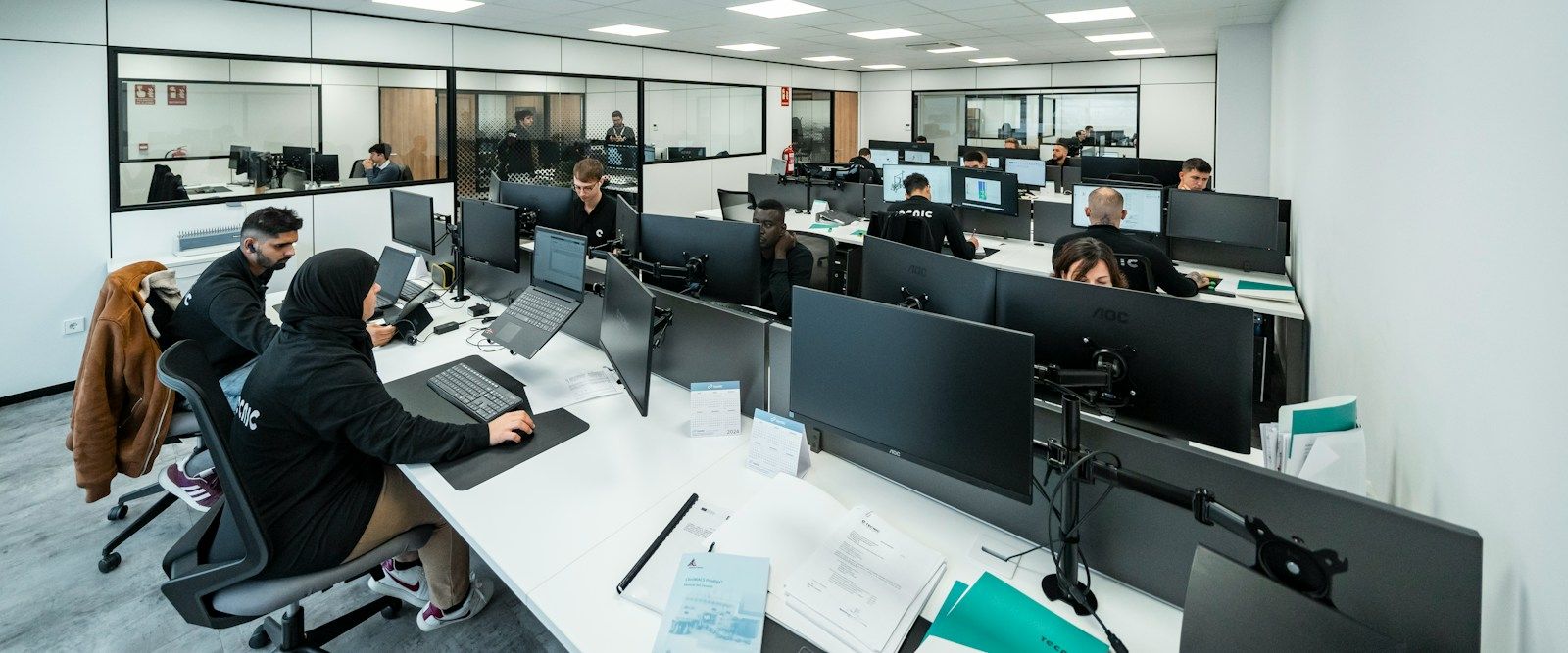 A team working on their computers in a bright open-plan office