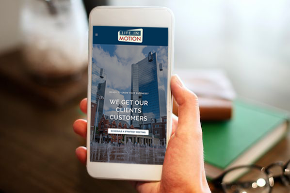 A person browsing the web on a mobile device, highlighting the importance of mobile-friendly website design and optimization.