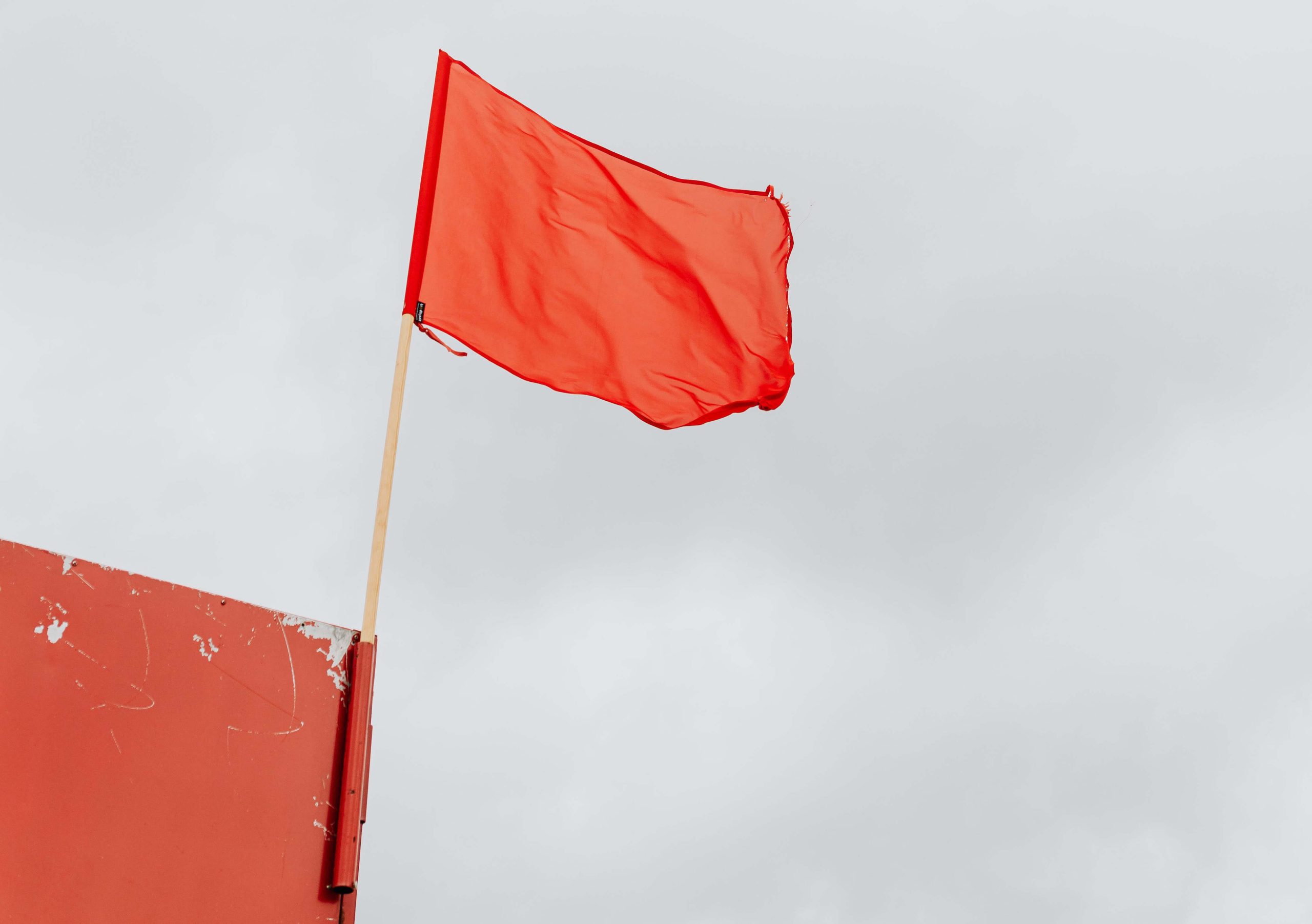 A visual representation of red flags to consider when hiring a marketing company, ensuring a successful partnership.
