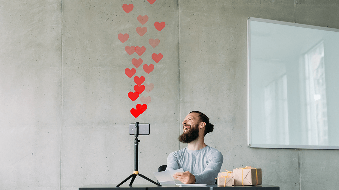 Man laughing at camera representing social media video ideas to humanize a brand.