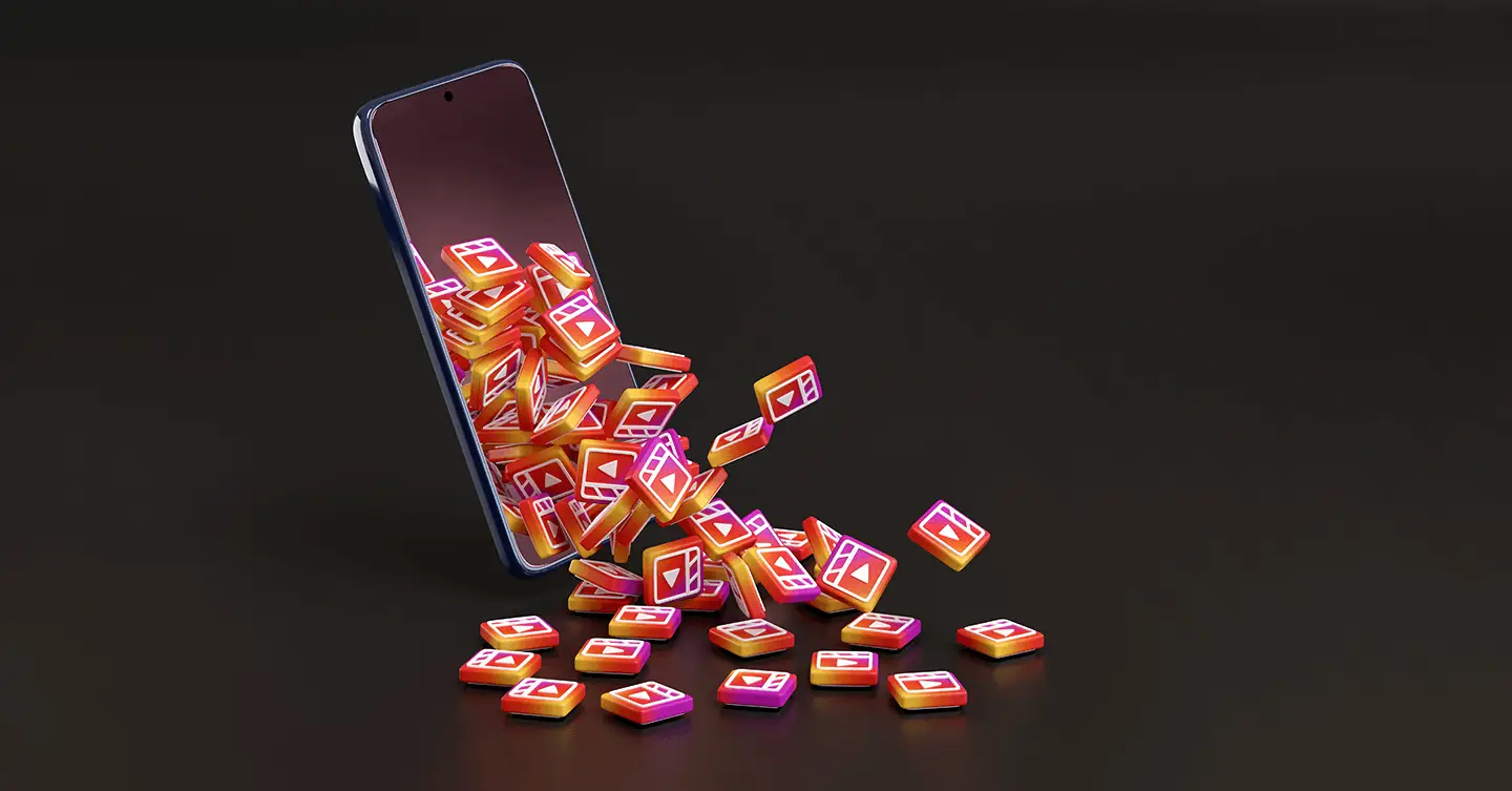 A smartphone screen overflowing with video play icons, symbolizing viral social media content, **digital media marketing**, and the volume of video creation needed for a successful, digital marketing strategy and online presence.