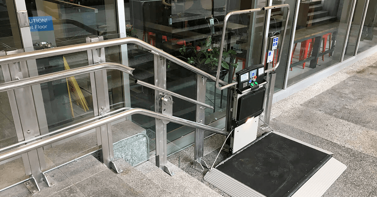 Vertical platform lift installed in a North Texas commercial building to address short-rise accessibility barrier