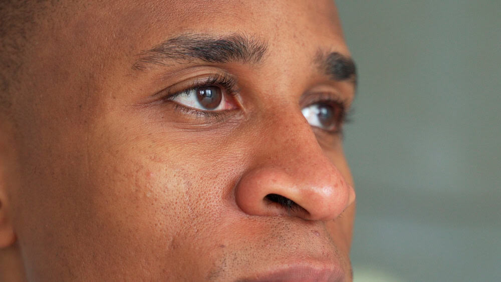 Close-up,Of,A,Black,Man's,Eyes.,Eyes,Of,A,Thoughtful | Look Natural Atlanta - Micropigmentation Clinic Close-up side view of a man with natural dark eyebrows.