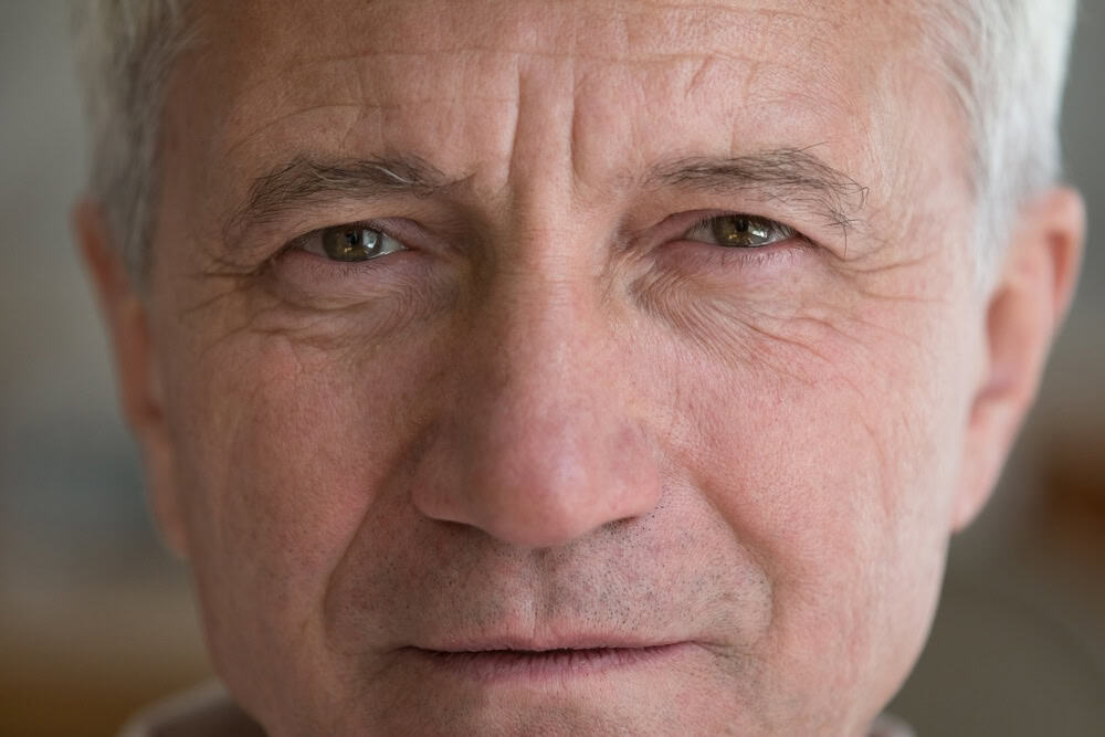 Face,Of,Serious,Mature,Elder,Man,With,Brown,Eyes,,Wrinkles. | Look Natural Atlanta - Micropigmentation Clinic Older man with natural eyebrows looking into the camera.