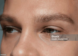 Close-up of man’s face focusing on natural eyebrow shape.