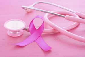 Pink ribbon symbol representing breast cancer awareness and post-mastectomy reconstruction support