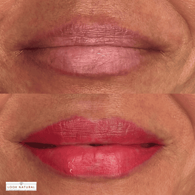 Close-up of a mouth wearing two-tone lipstick: light pink on the upper lip and bright red on the lower lip.