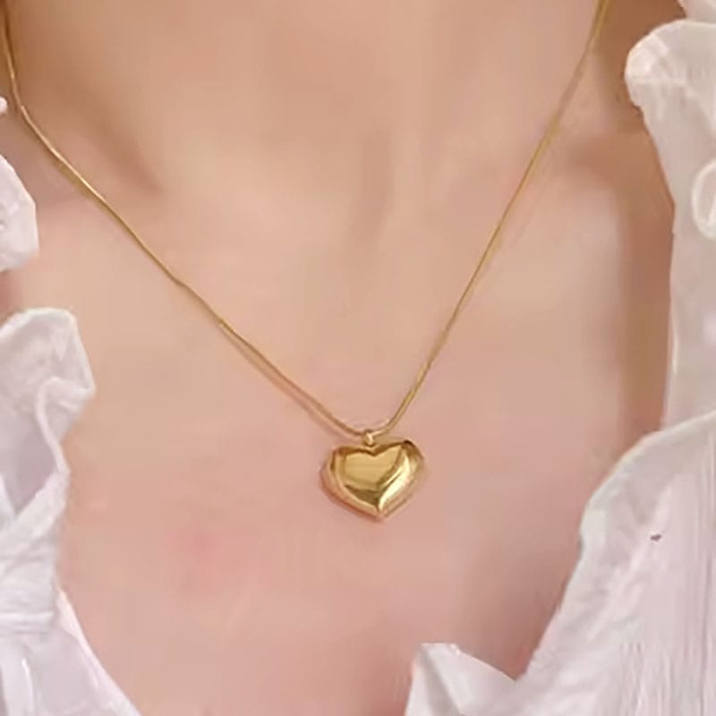 gladde ketting met hartjes bedel