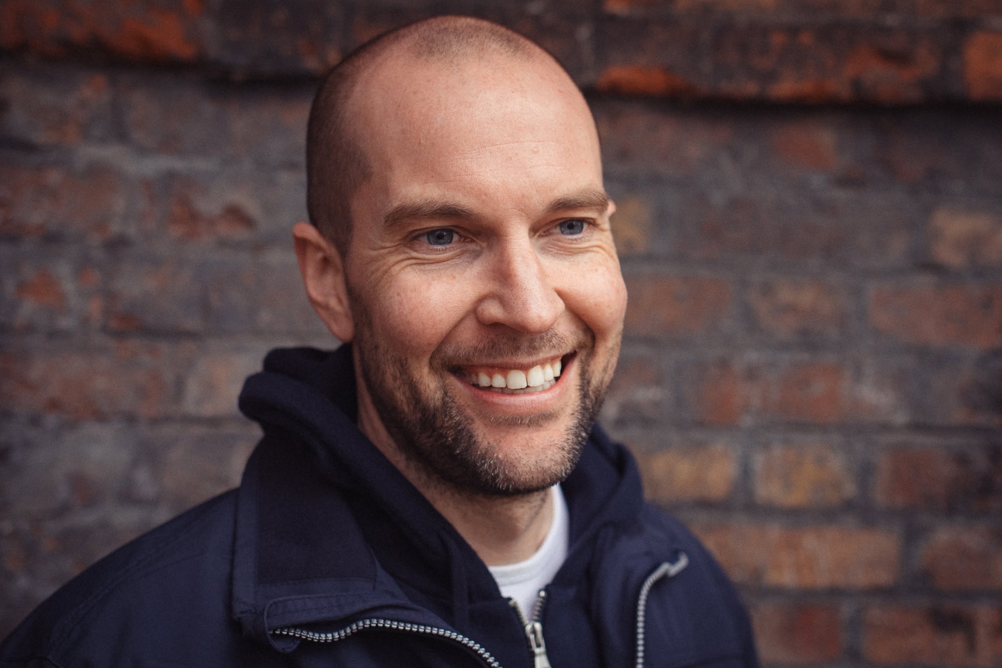 Clive Maxheath, a London brand photographer, captured in a natural, confident portrait with soft light.