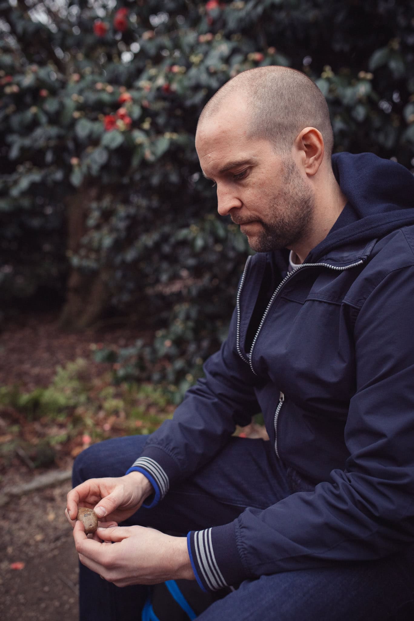 Clive Maxheath, a coach, in a thoughtful pose outdoors, captured by a London brand photographer.