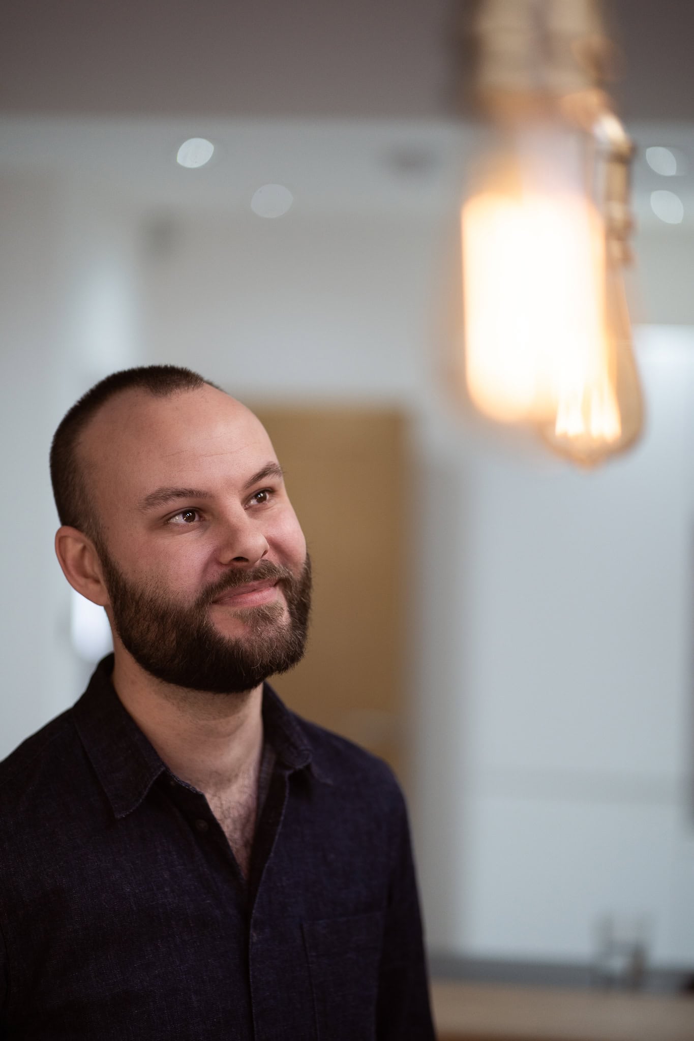 Ben Laplanche, a founder with a confident, authentic presence, captured in warm light by a London brand photographer.