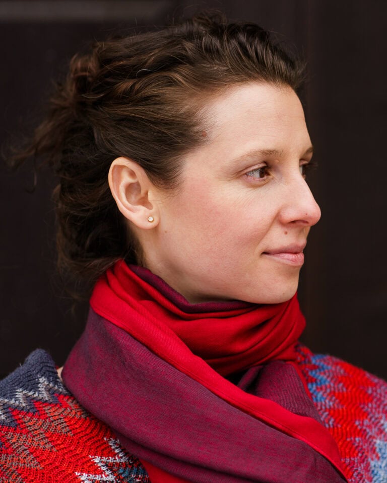 Moni Soos, a confident coach, photographed in London with soft, natural light.