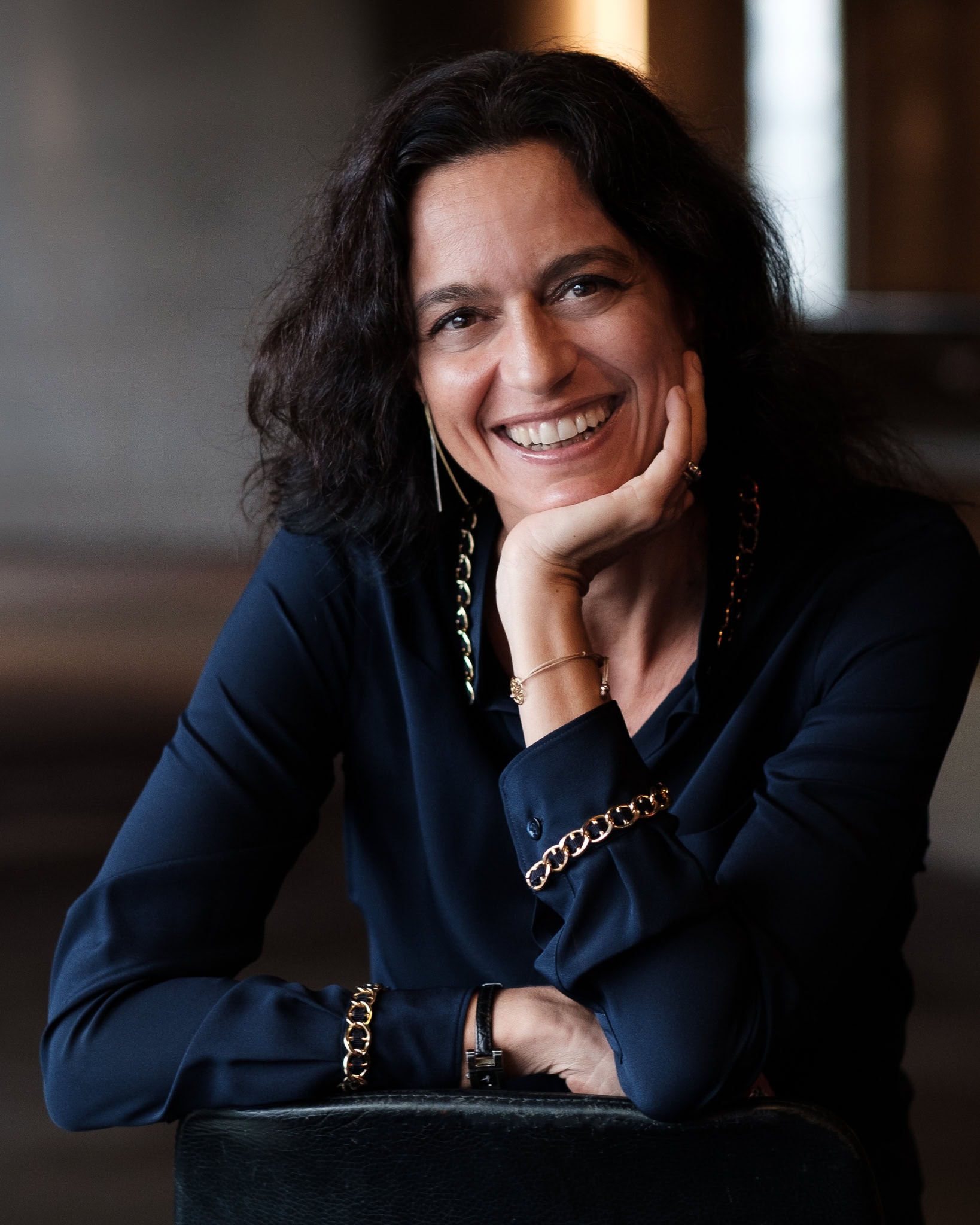 Vittoria Zipoli, a confident and authentic leader, photographed with warm light by a London brand photographer.