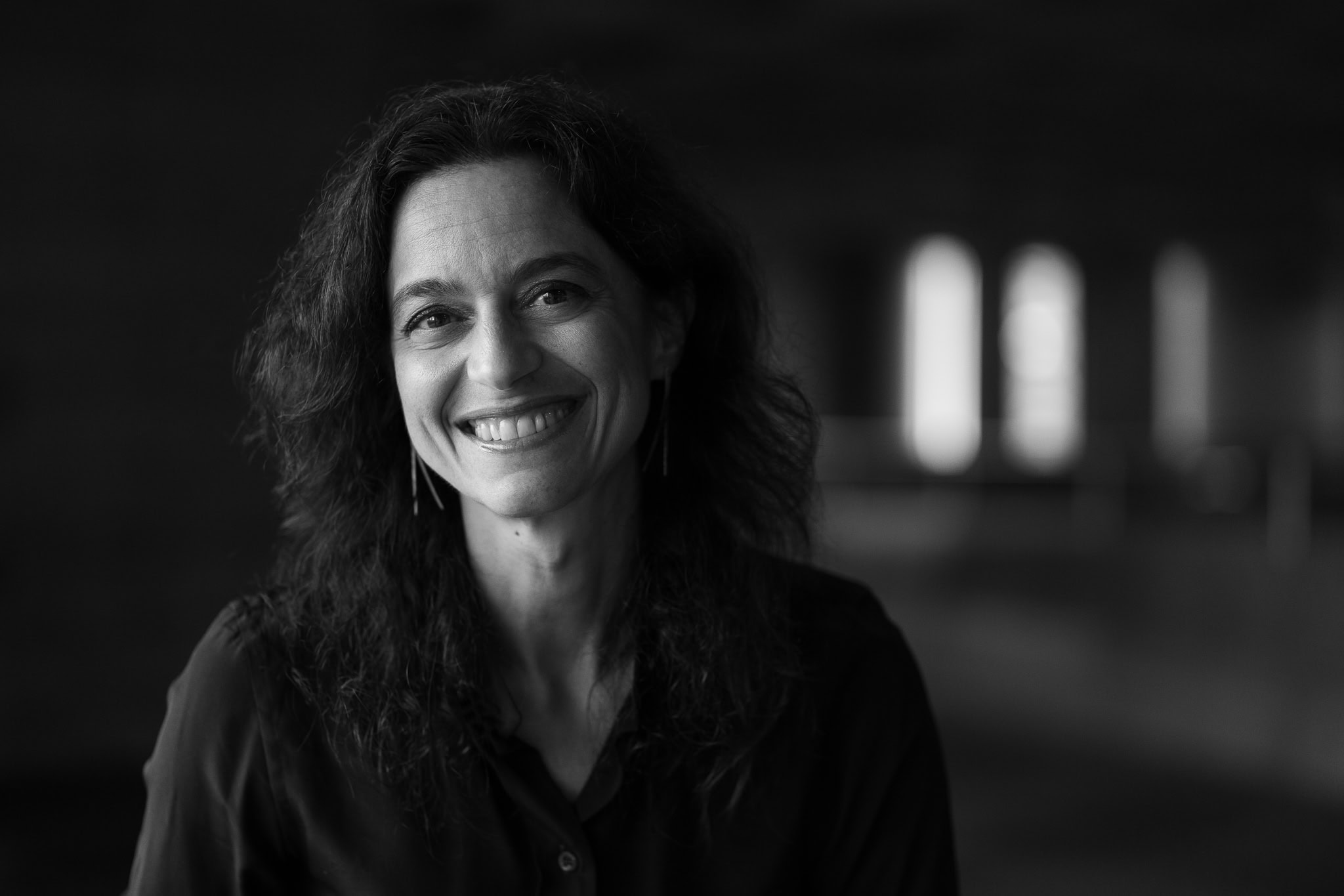 Vittoria Zipoli, a coach, in a warm, authentic London brand portrait by Phil Askew.