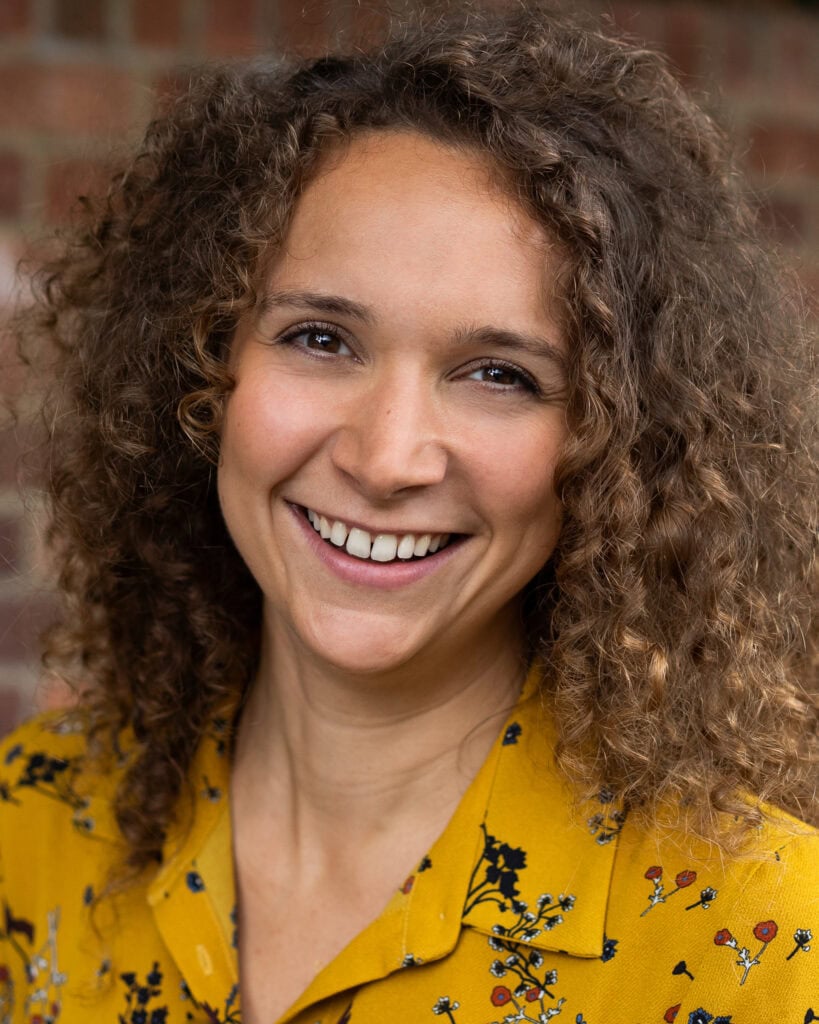 Lorraine Wilkes, a confident and authentic coach, photographed in London with warm light.