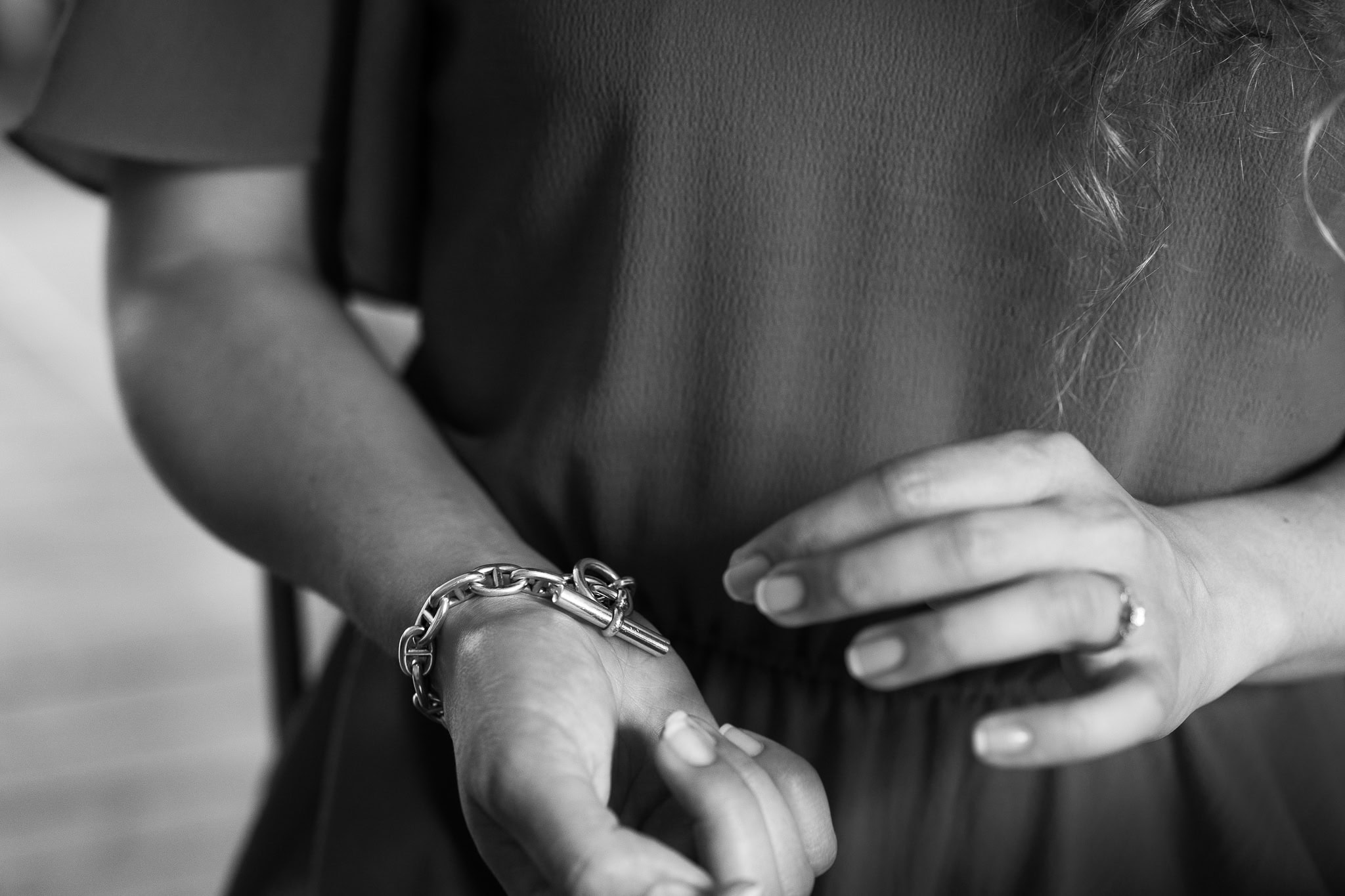 Lorraine Wilkes, a coach, displays her authentic presence with a statement bracelet and ring, captured by a London brand photographer.