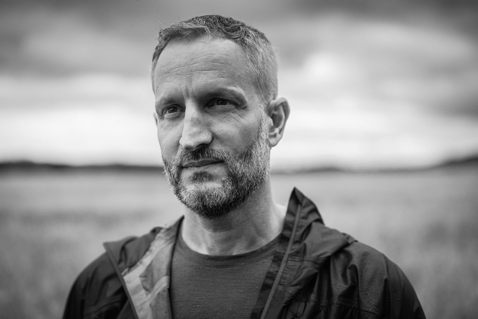Andrew Willson, a coach with a confident, authentic presence, captured in a natural light portrait by a London brand photographer.