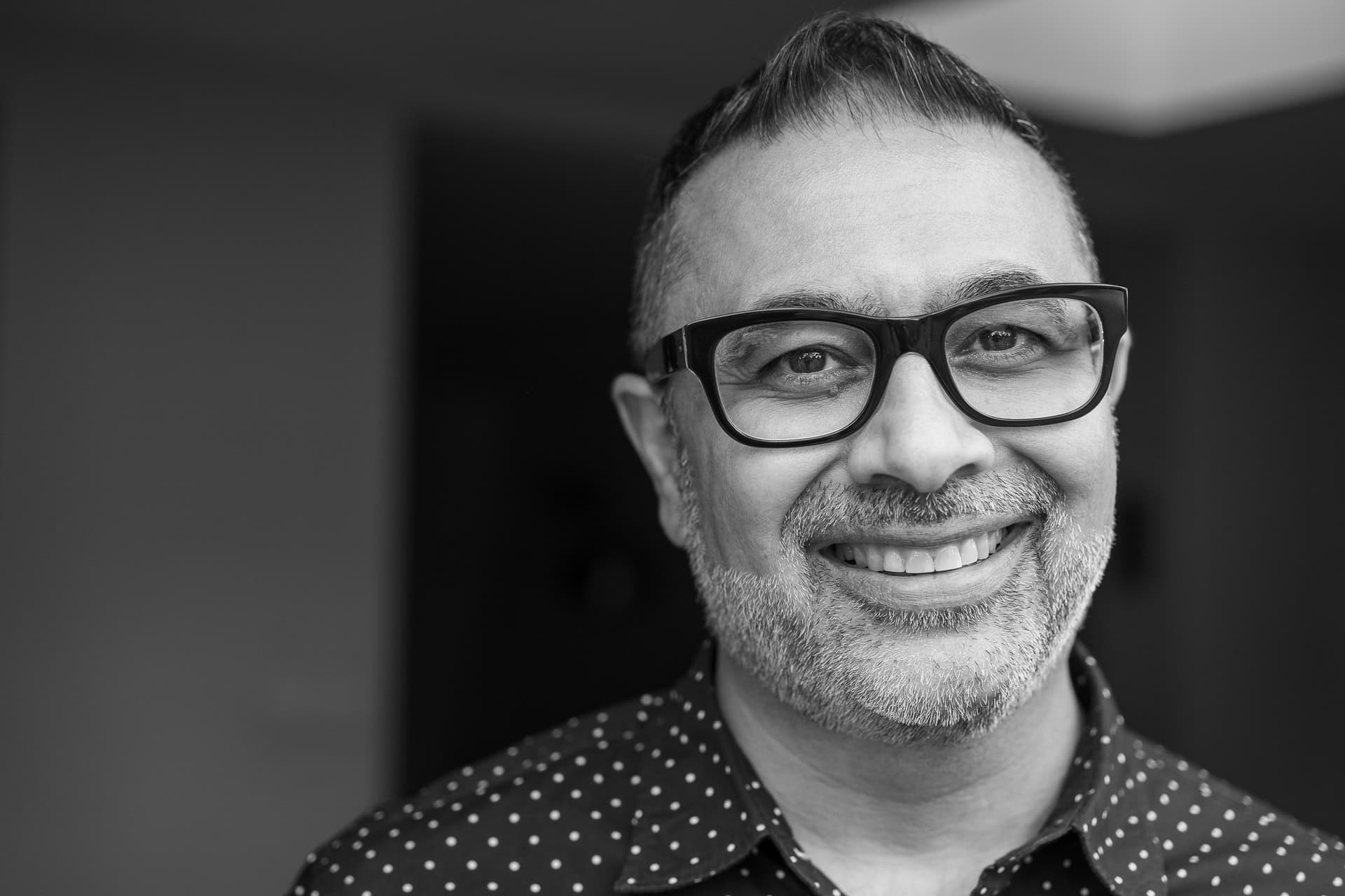 Dipak Dave, a coach, in a black and white portrait by London brand photographer Phil Askew.