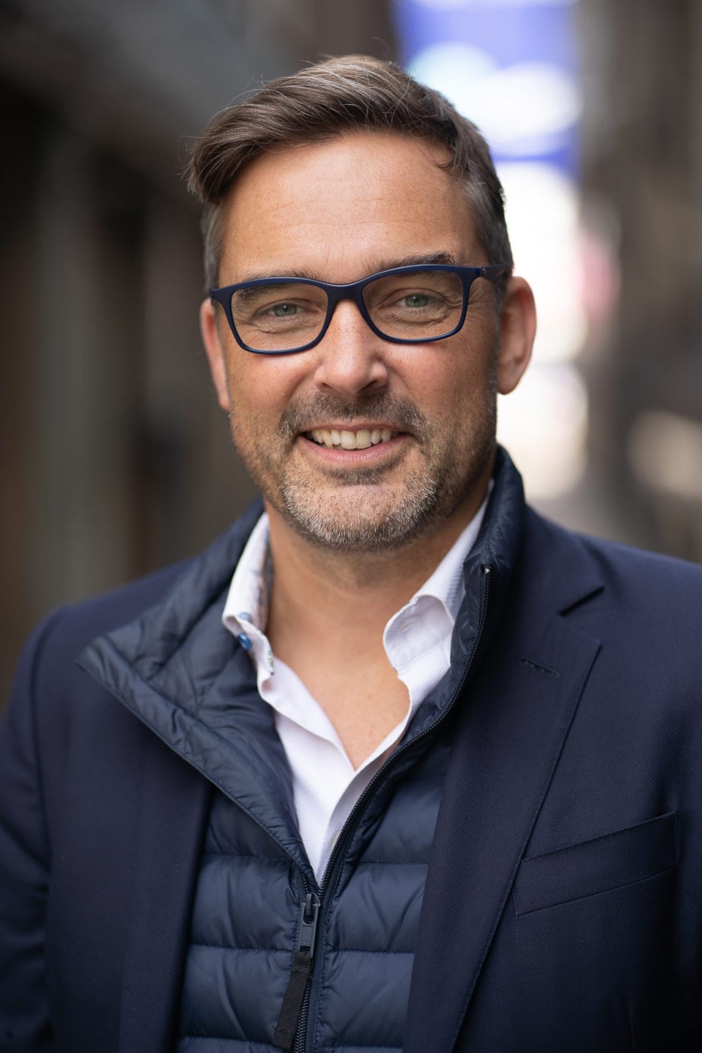 Phil Askew, London brand photographer, capturing a confident coach's personal brand portrait in natural light.
