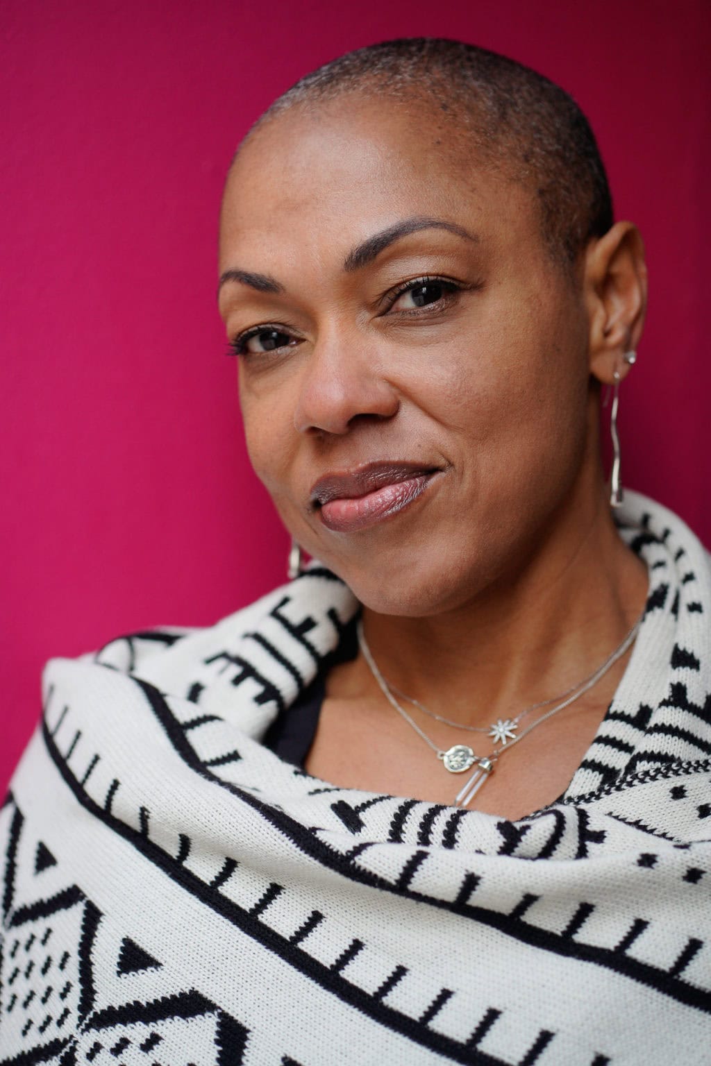 Sharlene Jones, a confident leader, captured in natural light by a London brand photographer.