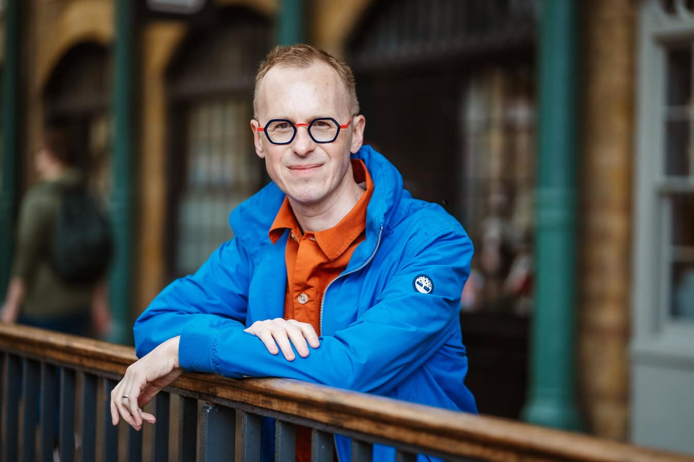 Phil Askew, London brand photographer, captured in a warm, authentic portrait, embodying confident leadership.