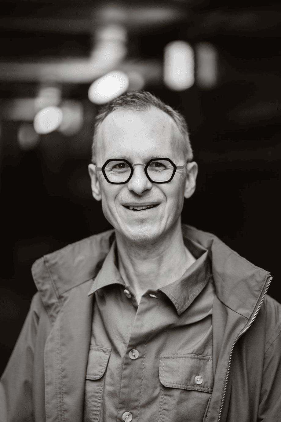 Richard Jones, a coach, with a confident, authentic presence, captured in natural light by a London brand photographer.