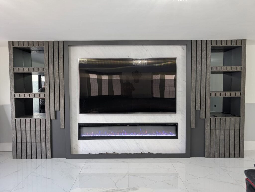 Contemporary custom-built entertainment wall with modern fireplace and shelving units.