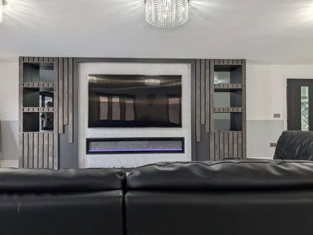 Sleek modern media wall with custom wood and marble finish, integrated electric fireplace, perfect for stylish interiors.