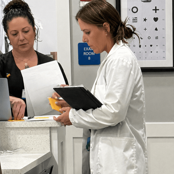 Sarah Morgan, healthcare professional at Make You Well, providing attentive and compassionate care during a patient consultation.