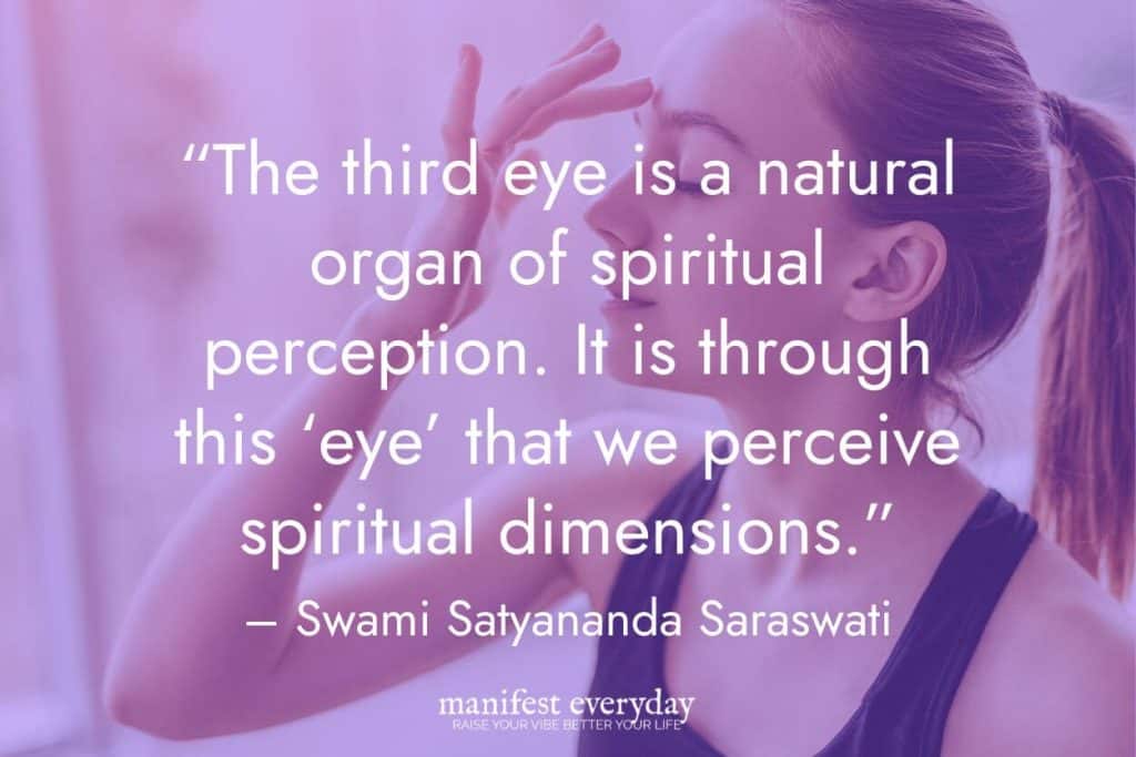 Woman touching her third eye chakra to tap into intuition with quote text that reads “The third eye is a natural organ of spiritual perception. It is through this ‘eye’ that we perceive spiritual dimensions.” - Swami Satyananda Saraswati manifesteveryday.com
