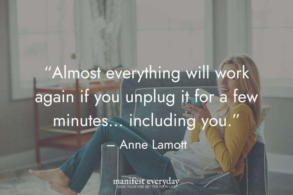 young woman relaxes with a beverage in a comfy chair in brightly lit room with quote text that reads “Almost everything will work again if you unplug it for a few minutes... including you.” - Anne Lamott manifesteveryday.com