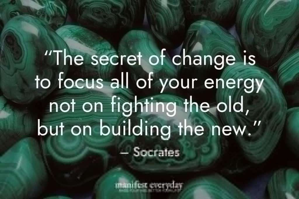 several smooth, tumbled Malachite stones with quote text that reads “The secret of change is to focus all of your energy not on fighting the old, but on building the new.” – Socrates manifesteveryday.com