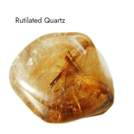 smooth, tumbled, amber colored rutilated quartz crystal with white background