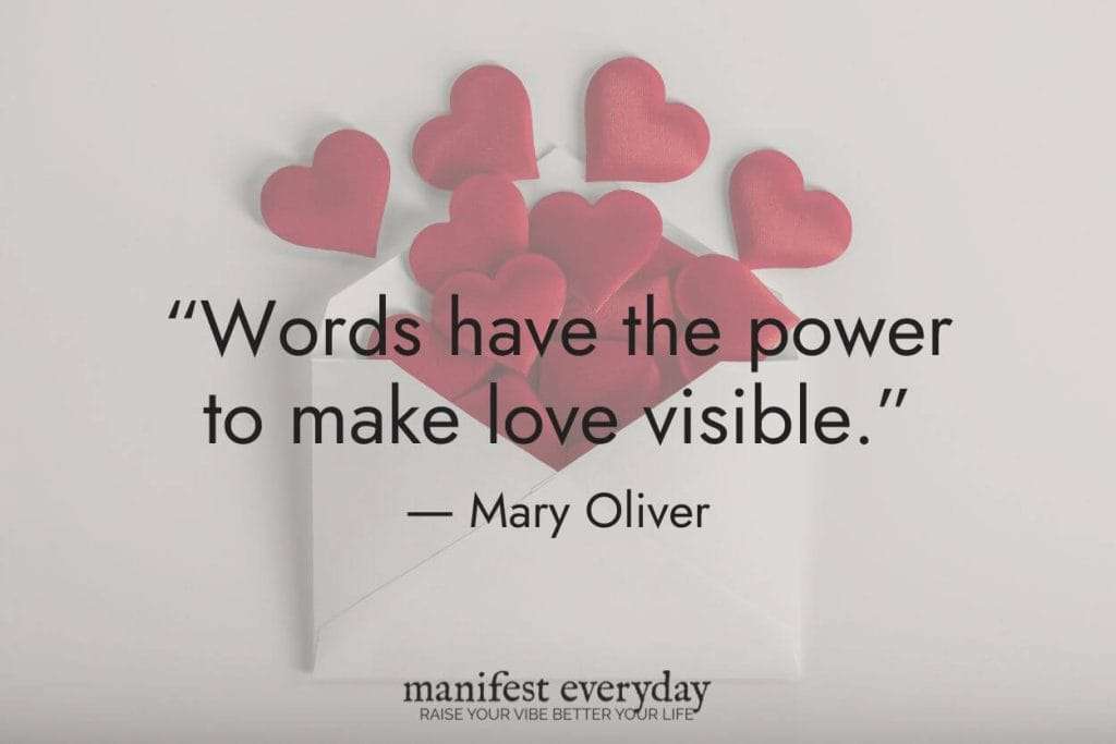 Quote image featuring pink paper hearts arranged in a bouquet shape with text reading 'Words have the power to make love visible. - Mary Oliver' on a white background. Below includes manifesteveryday.com logo with tagline 'RAISE YOUR VIBE BETTER YOUR LIFE